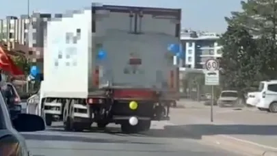 Balonla süslü kamyonun sürücüsünün hareketleri pes dedirtti